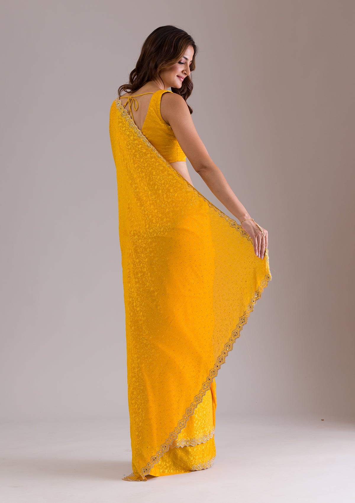Mustard Stonework Semi Crepe Saree