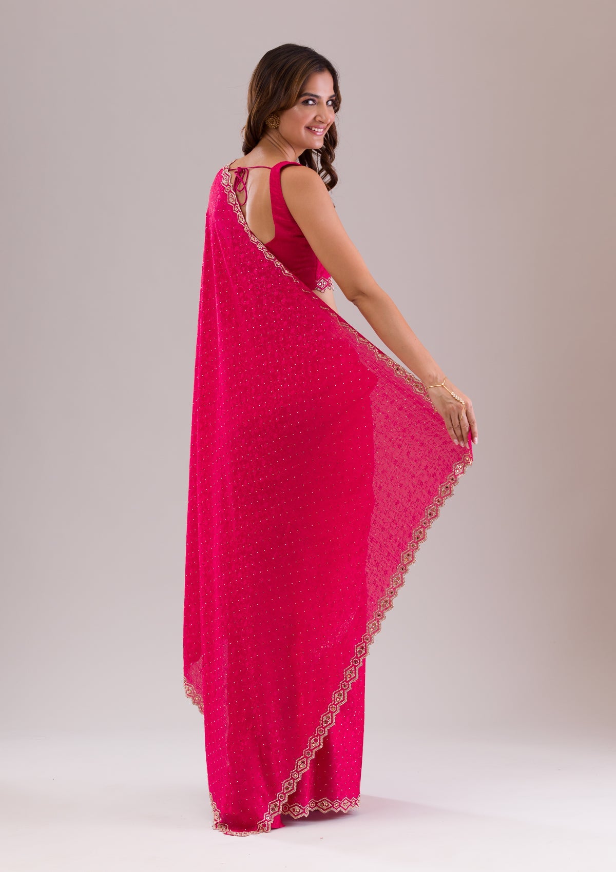 Rani Pink Stonework Semi Crepe Saree